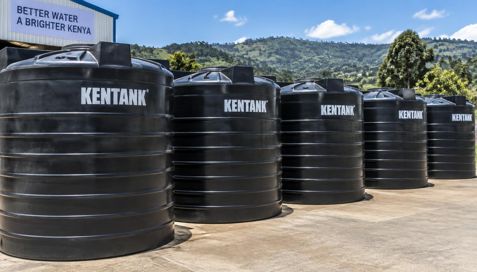 Row of black Kentanks plastic water storage tanks in Kenya